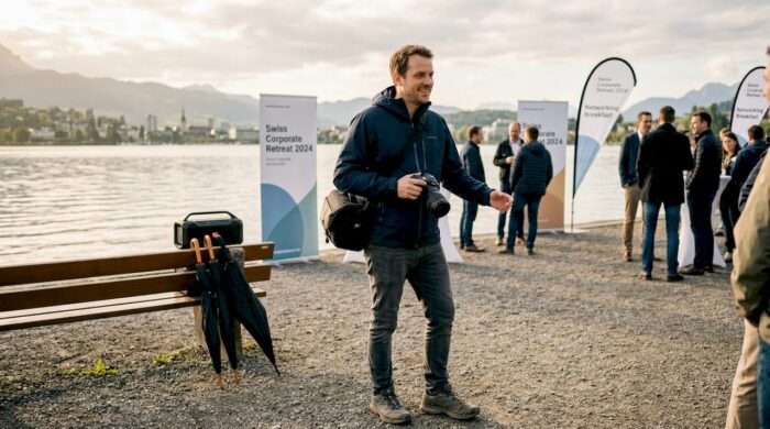 Photographer covering outdoor corporate event in Zug