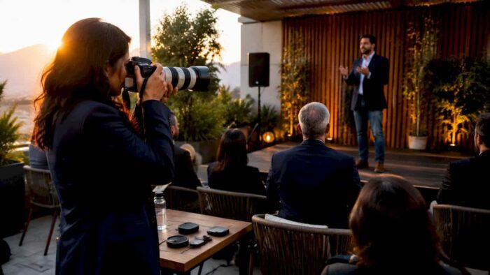 Photographer capturing keynote speaker at WEF event