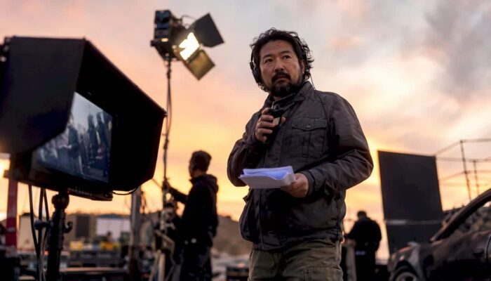 Director coordinating action shoot on studio set