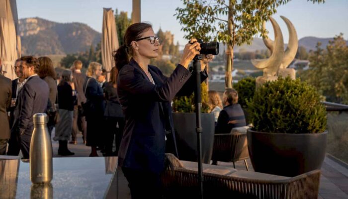 Photographer capturing candid moments at WEF conference