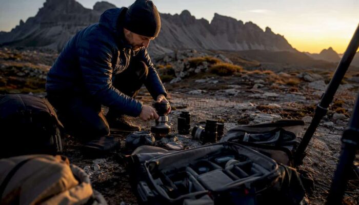 Editorial photographer preparing gear outdoors